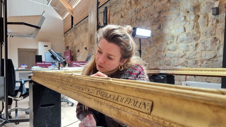 Conservator Jonida Mecani working on the Diomedes and Cressida frame - National Trust Michael Cole.jpg