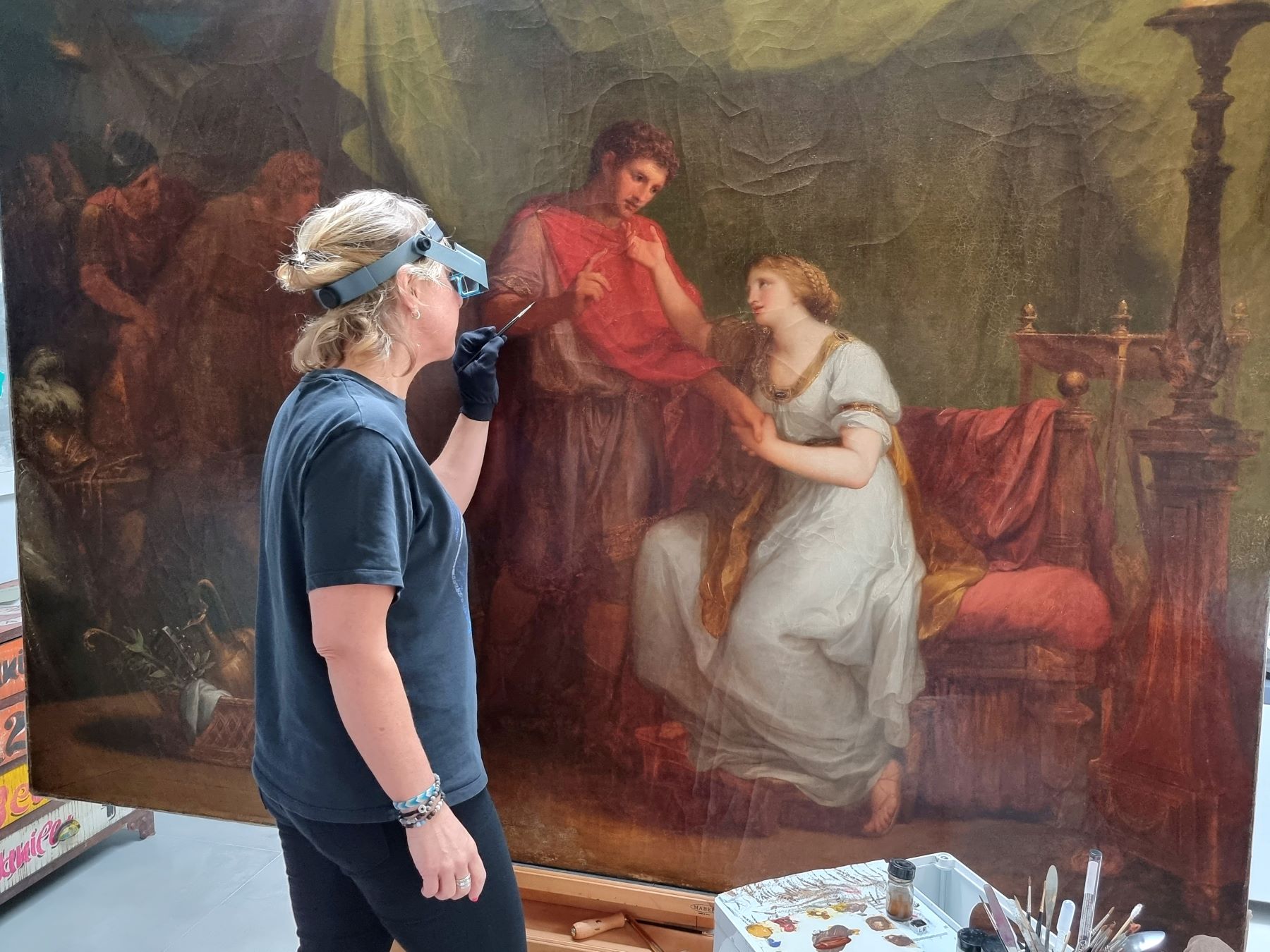 Conservator Sophie Reddington at work on Diomedes and Cressida - National Trust Michael Cole.jpg